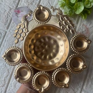 PEACOCK and DIYA urli