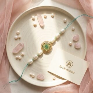 Resin Real flower rakhi - teal (queens anne lace )