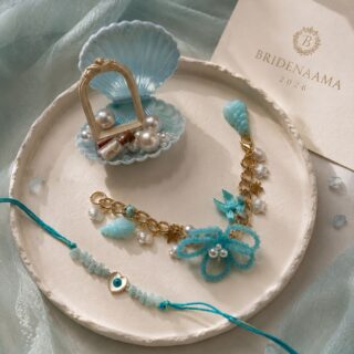 Beauty by the bay - rakhi , lumbi and rolichawal combo - sea shells , charms ,pearls